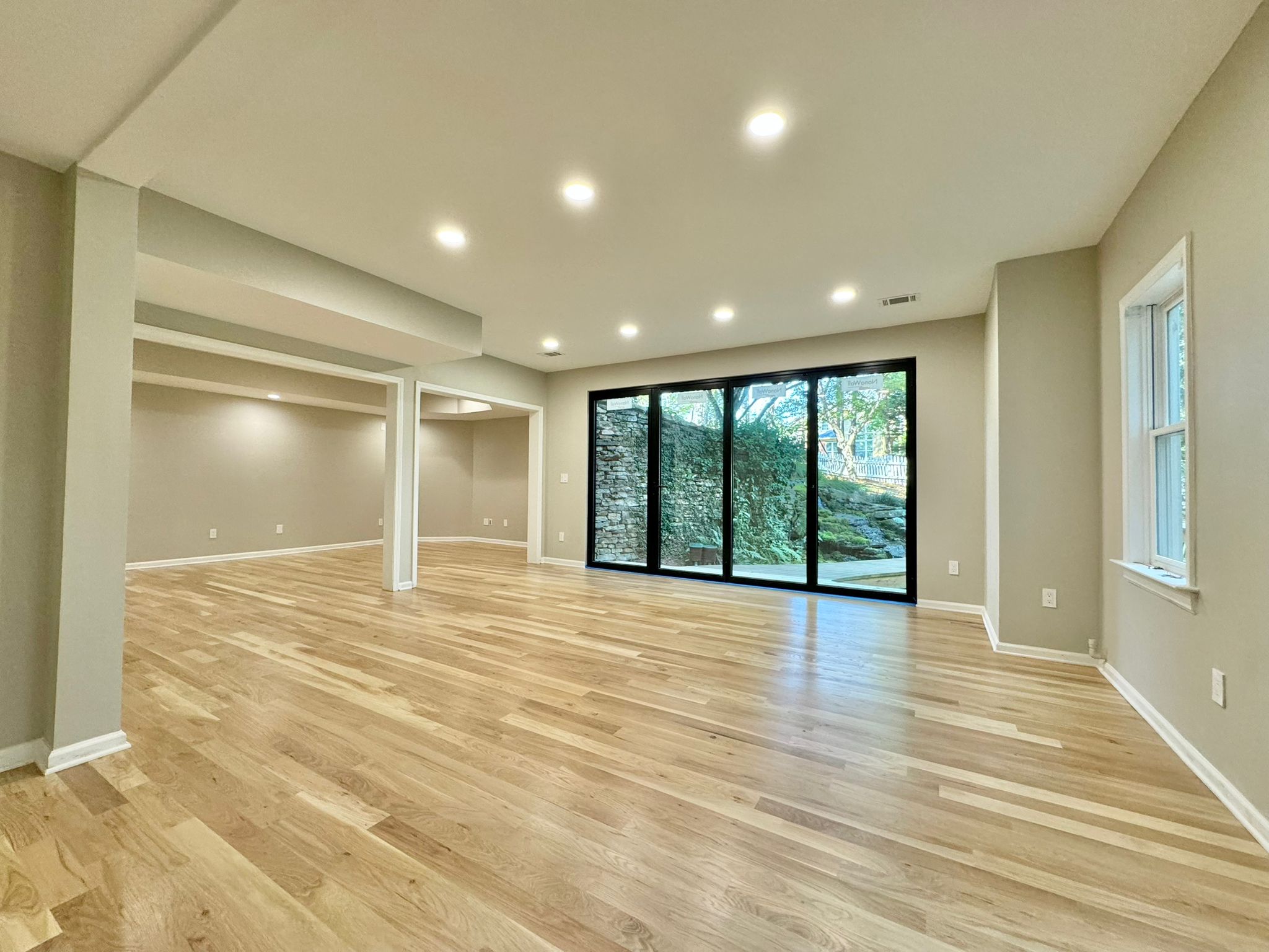 Light hardwood flooring in an open living space from JCB Flooring’s portfolio